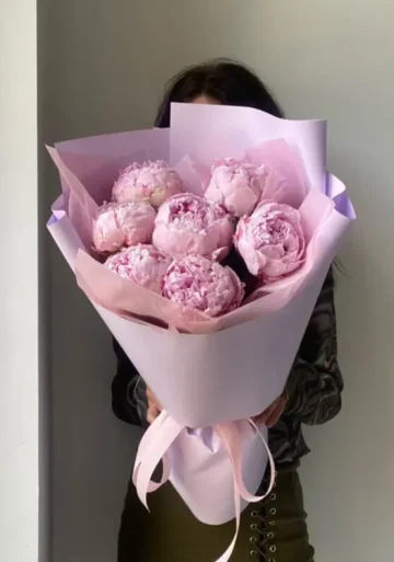 A bouquet of soft pink peonies